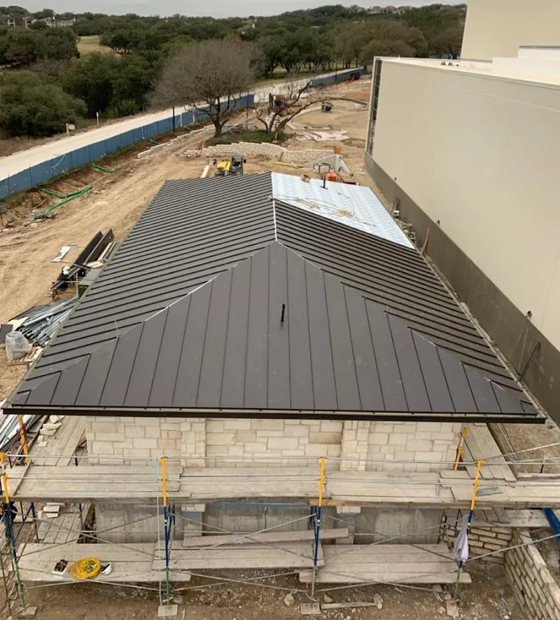 Metal roof new construction with scaffolding in Pooler